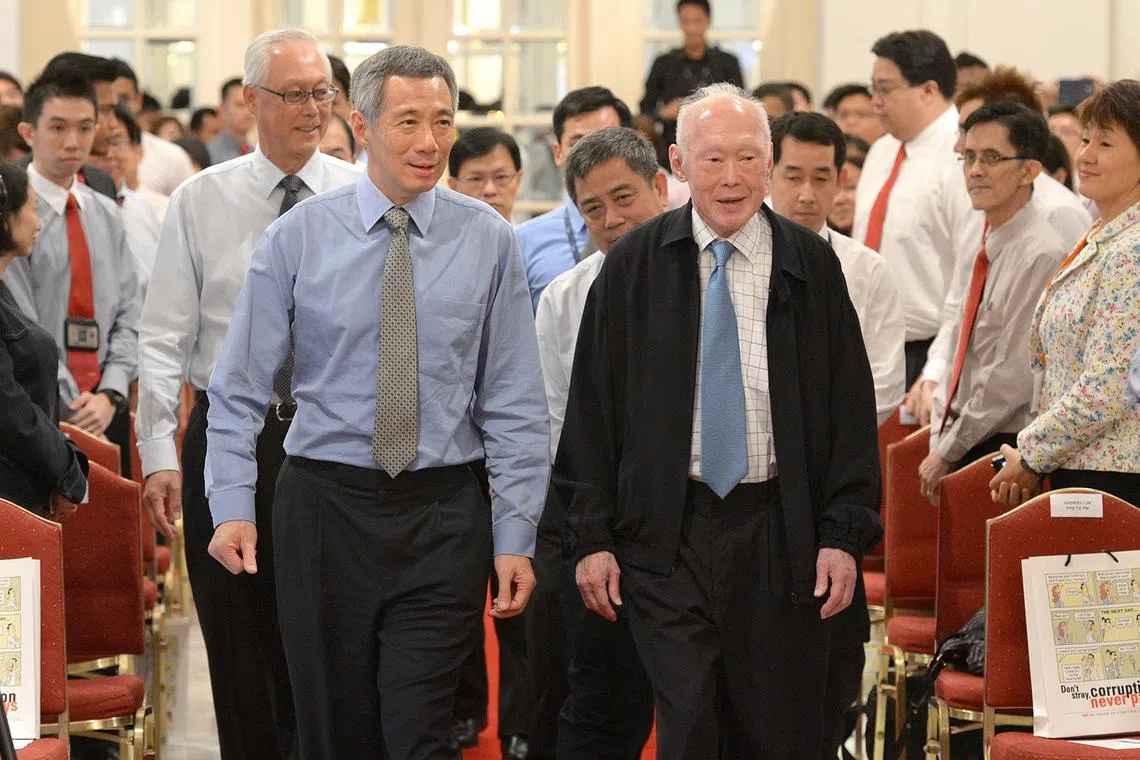 PM Lee Hsien Loong with founding prime minister Lee Kuan Yew and then Emeritus Senior Minister Goh Chok Tong (behind PM Lee) in 2012.