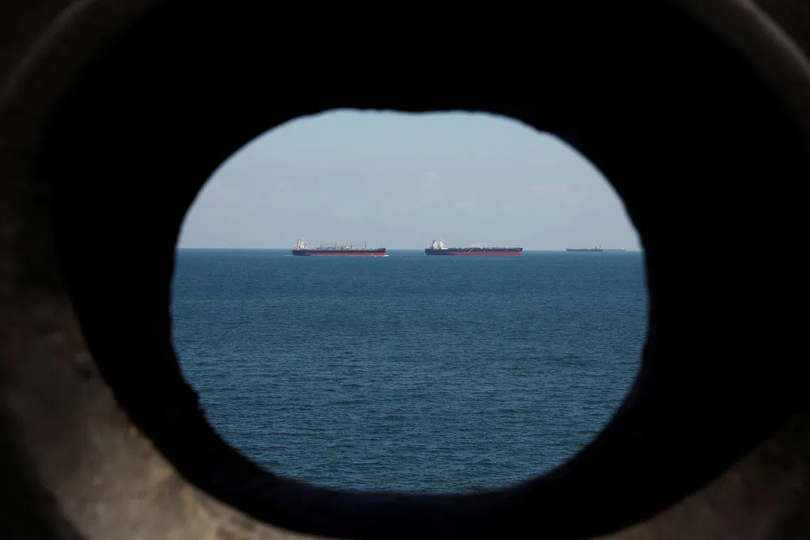 FILE PHOTO: Oil tankers are pictured in the waters off Tuas in Singapore July 15, 2019. Picture taken July 15, 2019.  REUTERS/Edgar Su/File Photo