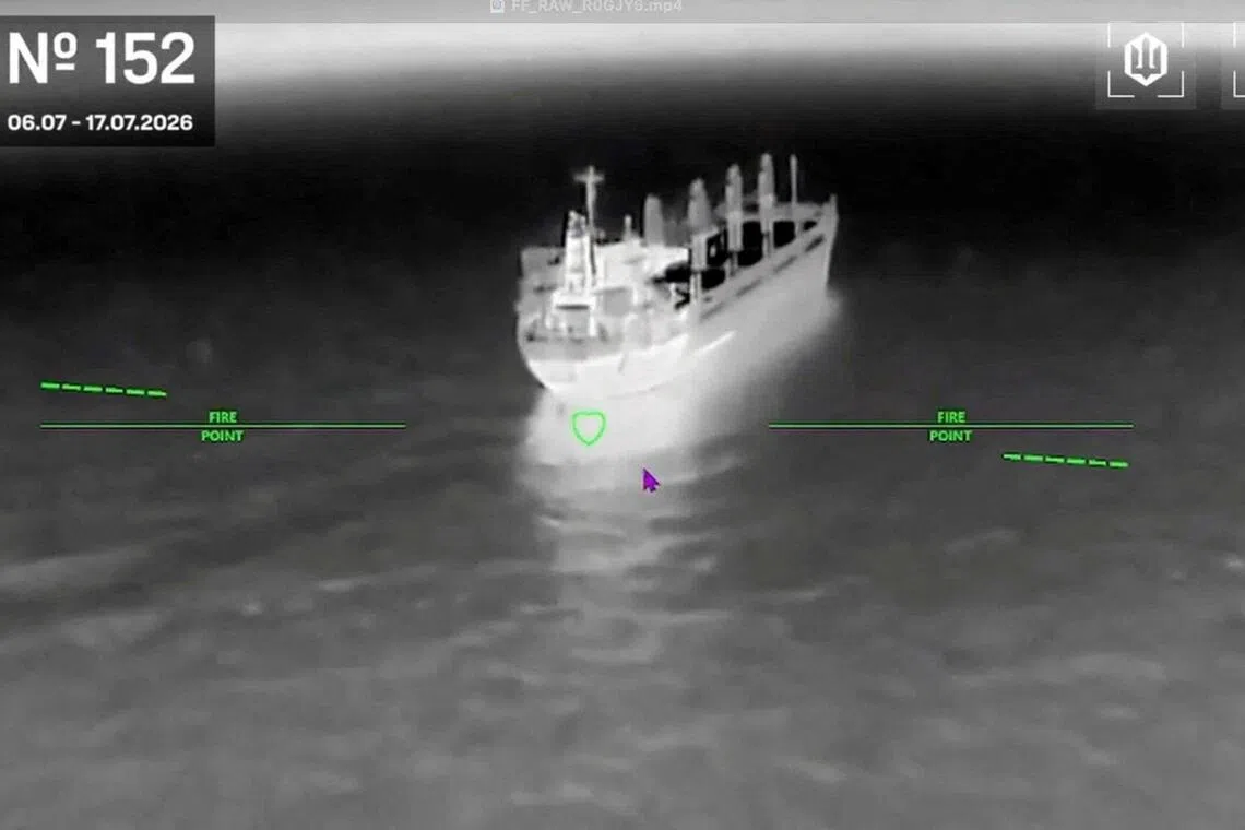 Aerial view of a ship on the water with overlaid text and markers.