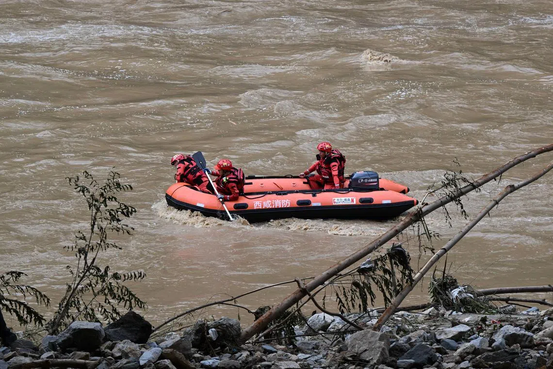 epa11488906 Rescuers work at the site of a bridge collapse in Zhashui County in Shangluo City, northwest China's Shaanxi Province, 20 July 2024. A highway bridge collapse triggered by torrential rains in northwest China's Shaanxi Province has killed 12 people and left 31 missing, local authorities said on 20 July. The bridge, located in Zhashui County in Shangluo City, partially collapsed around 8:40 p.m. on 19 July, due to a sudden downpour and flash floods, according to the provincial publicity department. A total of 17 cars and eight trucks plunged into the Jinqian River below the bridge based on initial investigation. As of 20 July noon, rescue workers had recovered seven of them and found 12 people dead, with one person rescued, said the provincial Party committee. Thirty-one people remain unaccounted for, and search efforts are ongoing.  EPA-EFE/XINHUA / ZHANG LING CHINA OUT / UK AND IRELAND OUT  /       MANDATORY CREDIT EDITORIAL USE ONLY EDITORIAL USE ONLY
