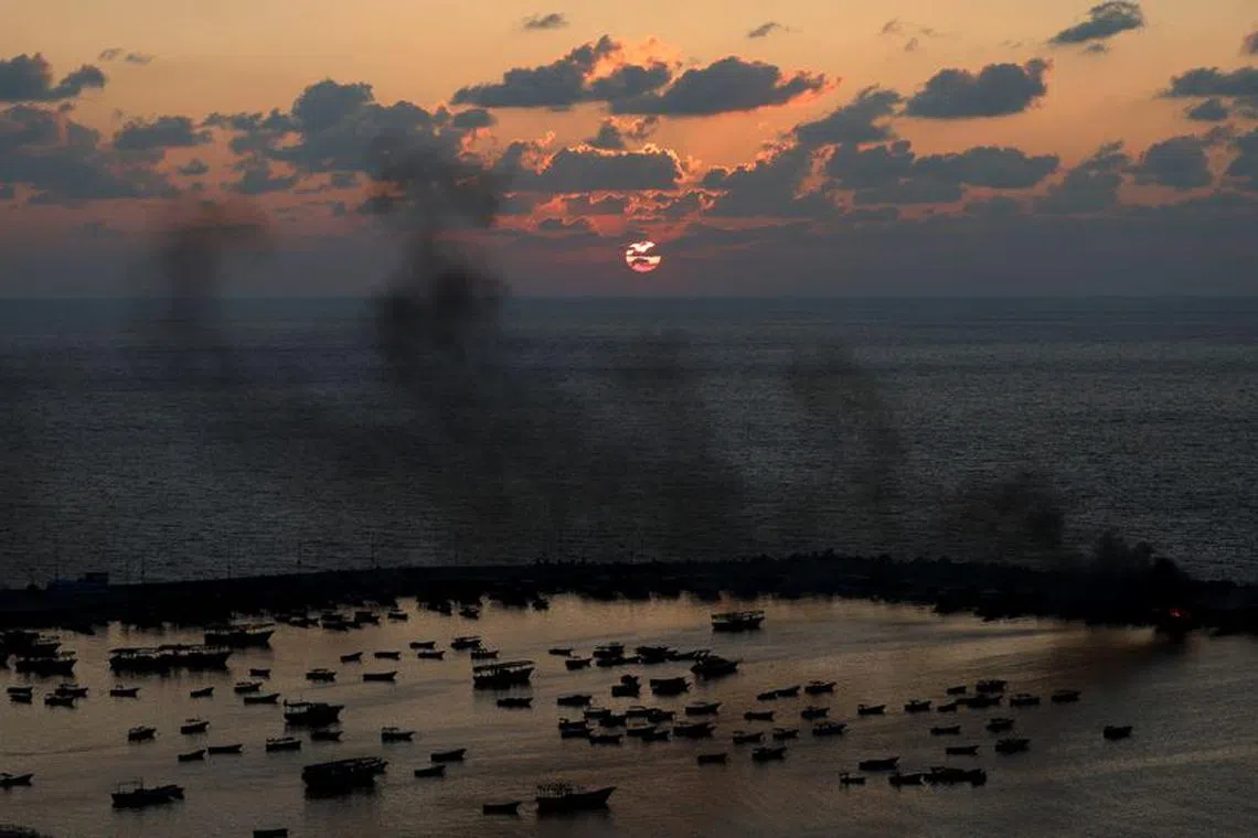 Smoke rises after Israeli strikes on the seaport of Gaza City, in Gaza, October 10, 2023. REUTERS/Mohammed Salem