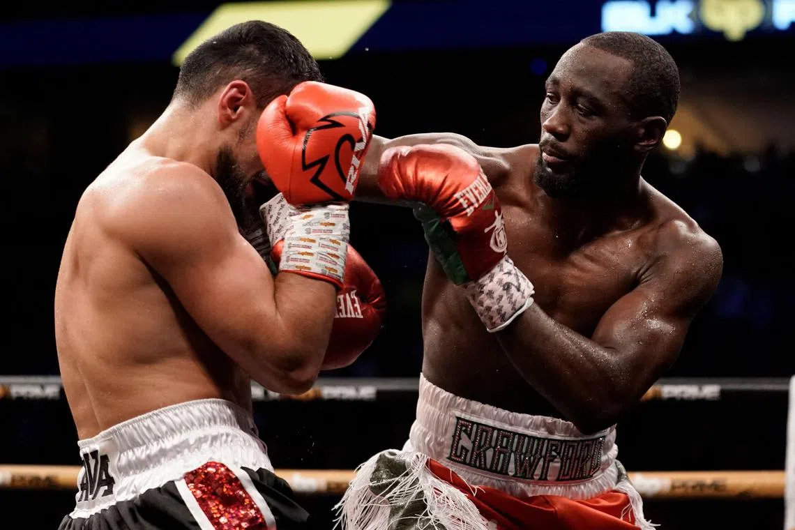 WBO champion Terence Crawford (right) punching David Avanesyan during their welterweight title fight at CHI Health Center in Omaha, Nebraska on Saturday. He won by knockout with a right hook at 2:14 of the sixth round, improving to 39-0 with 30 knockouts.