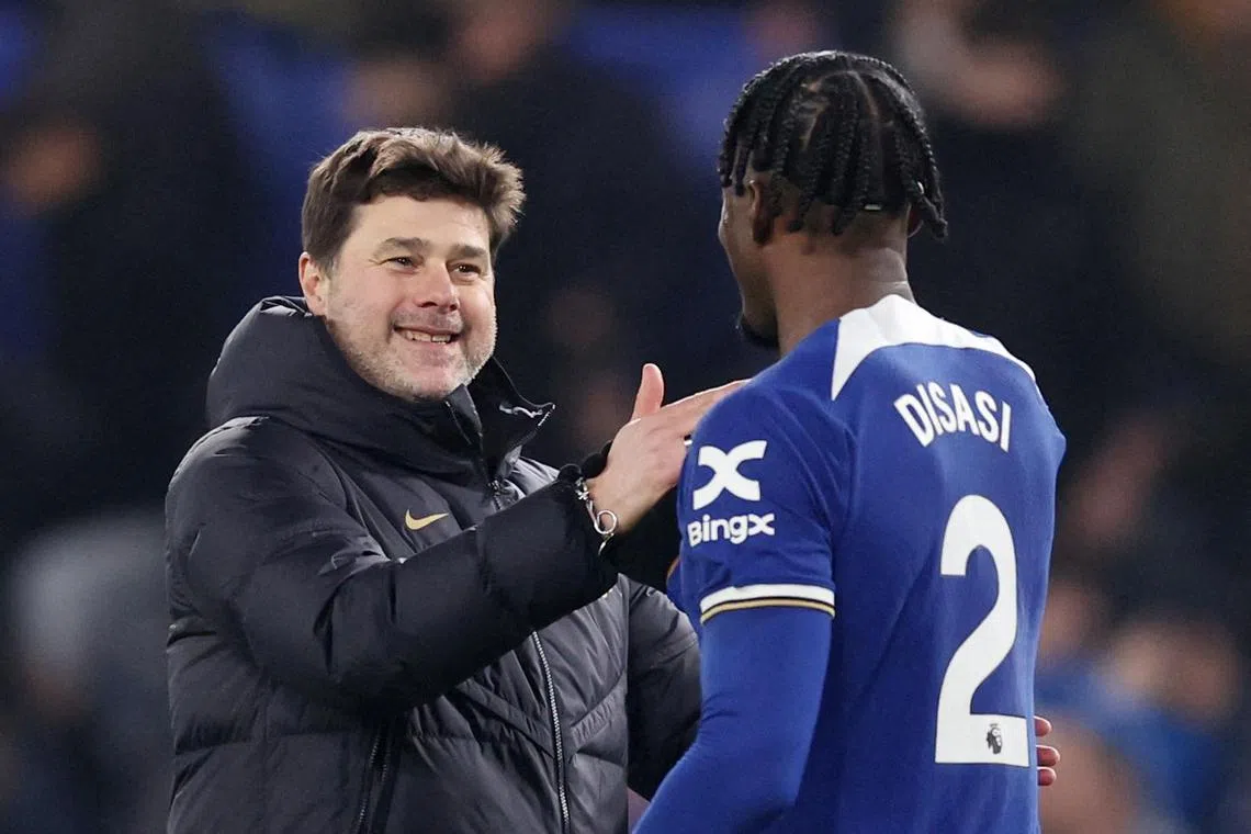 Chelsea manager Mauricio Pochettino is all smiles as he and Axel Disasi celebrate after the 3-2 Premier League win over Newcastle United.