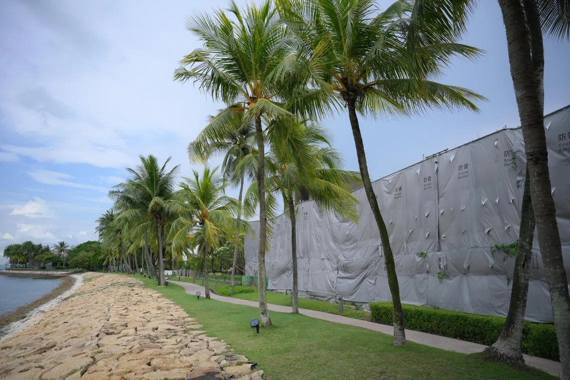 The rear view of the plot of land currently  covered by a sound barrier at 69 Ocean Drive in Sentosa Cove which is up for sale, pictured on April 15, 2024.