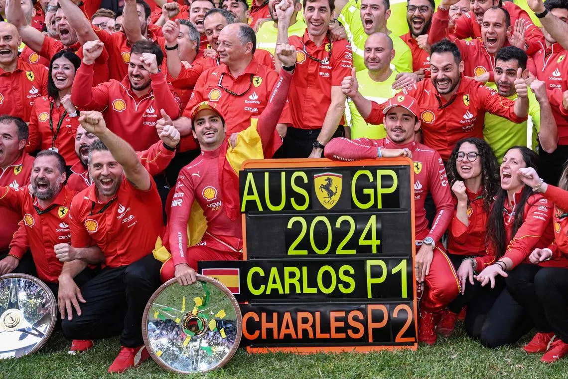 Ferrari's Carlos Sainz Jr (front centre left) and second-placed Ferrari's Monegasque driver Charles Leclerc (front centre right) celebrating with their team after the Australian Grand Prix.
