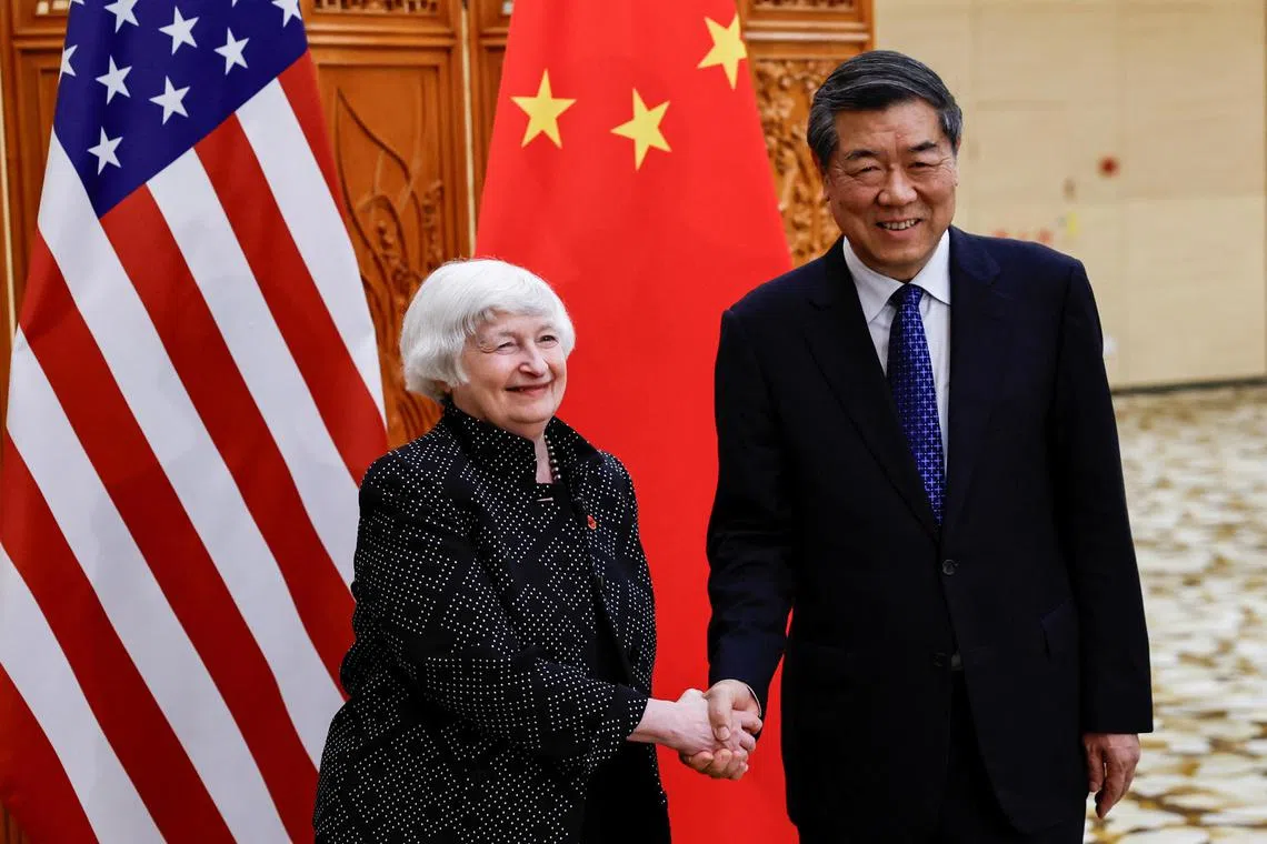 US Treasury Secretary Janet Yellen (left) shakes hands with China's Vice-Premier, Mr He Lifeng, in Guangzhou, Guangdong province.