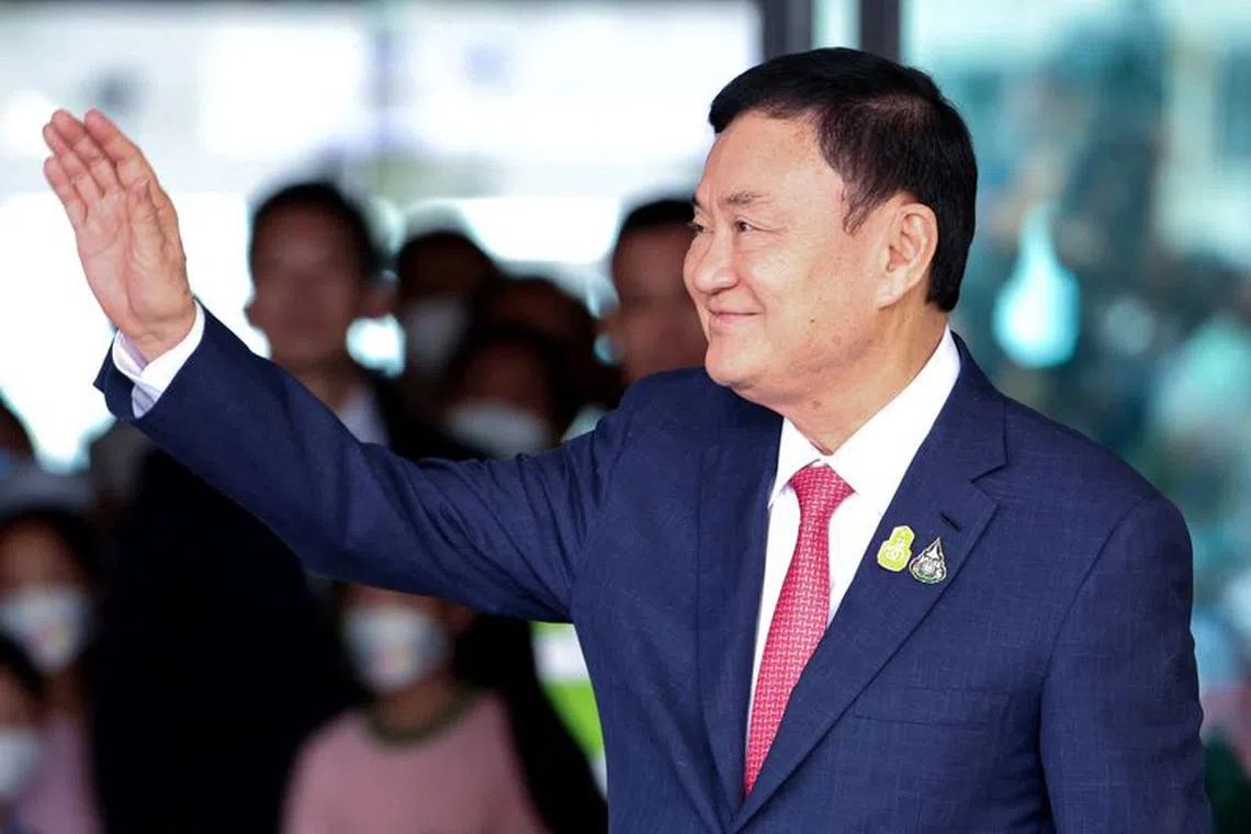 FILE PHOTO: Former Thai Prime Minister Thaksin Shinawatra, who is expected to be arrested upon his return as he ends almost two decades of self-imposed exile, waves at Don Mueang airport in Bangkok, Thailand August 22, 2023. REUTERS/Athit Perawongmetha/File Photo