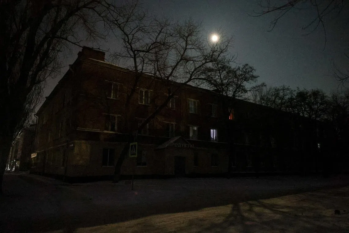 Residential buildings during a power blackout, that according to local authorities was caused by a recent Ukrainian missile attack targeting the regional energy system, amid the Russia-Ukraine military conflict in Belgorod, Russia. REUTERS/Stringer