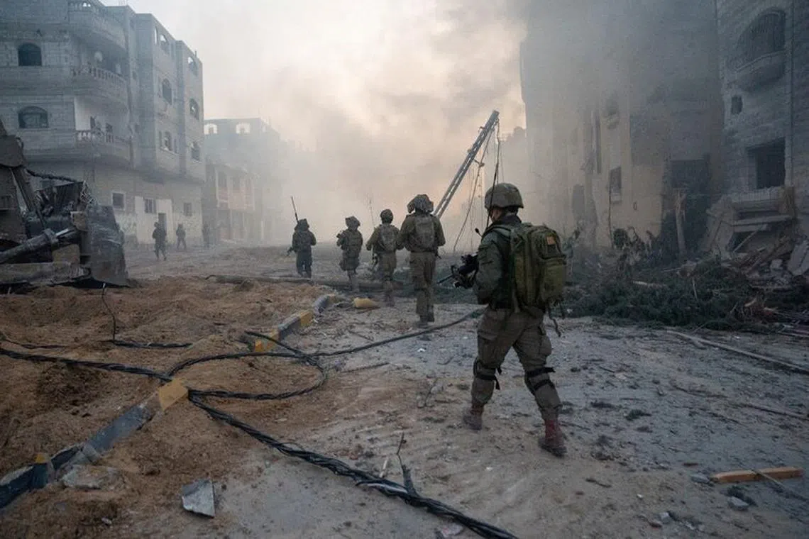 Israeli soldiers operate in the Gaza Strip amid the ongoing conflict between Israel and the Palestinian Islamist group Hamas, in this handout picture released on January 21, 2024. Israel Defense Forces/Handout via REUTERS/ File photo