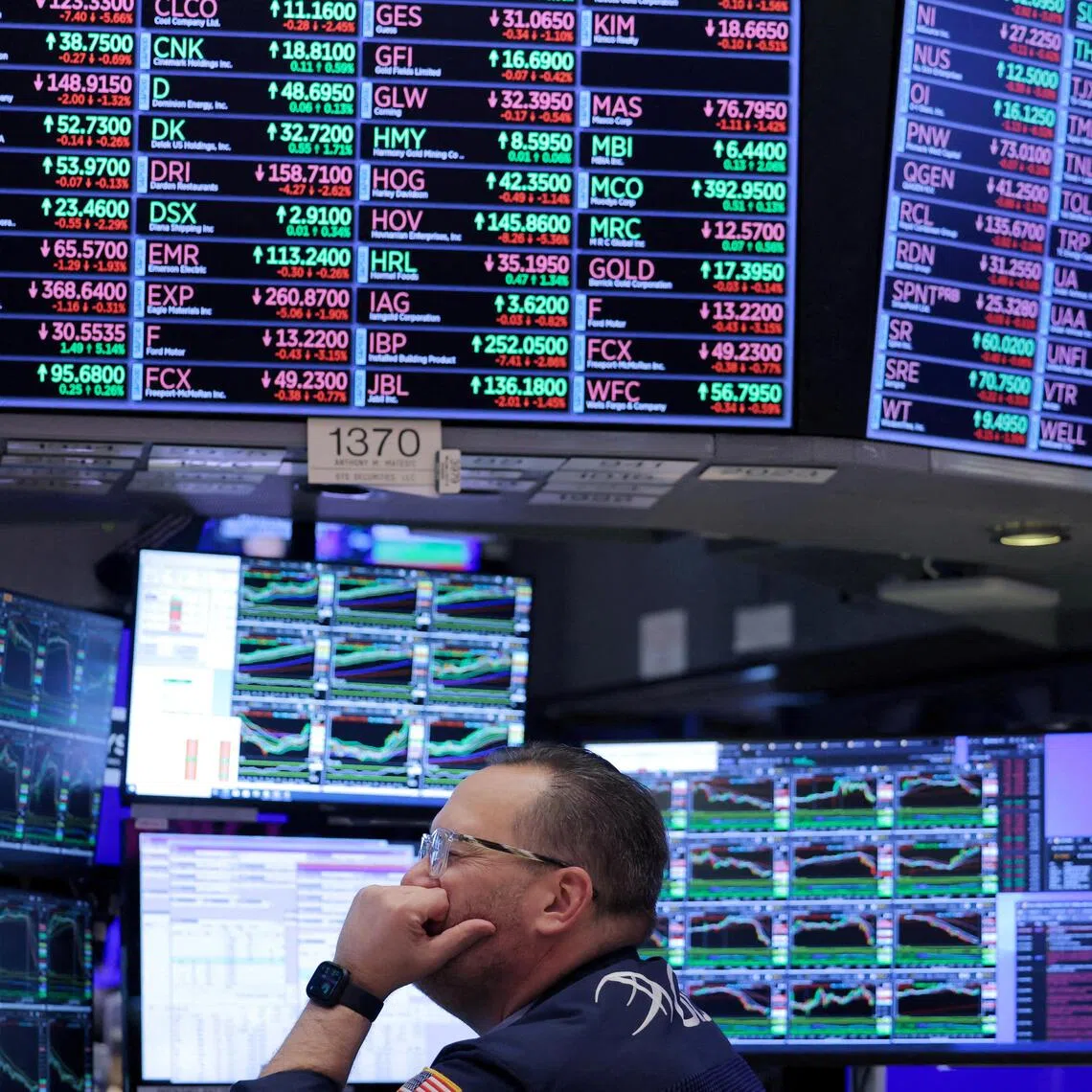 A trader works on the trading floor at the New York Stock Exchange in New York City.