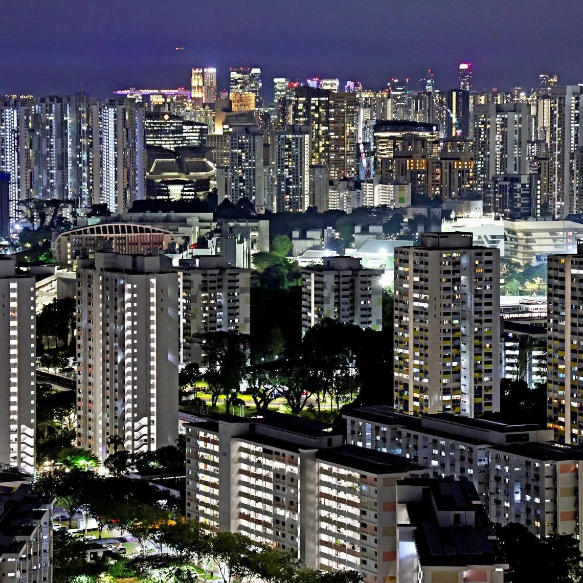 Public housing (HDB) and privates and office buildings seen from Clementi area on the night of Mar 3, 2026.
Can be used for stories about electricity, tariffs, taxes, cost, inflation, rebates, sustainability, ESG, climate resilience, energy market, CDC vouchers, rebates, PUB, housing policies.