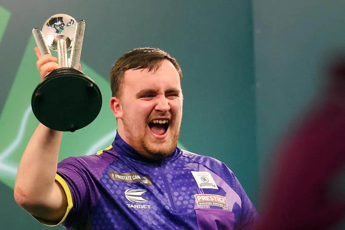 Luke Littler with the runner-up trophy after losing to Luke Humphries in the PDC World Darts final.