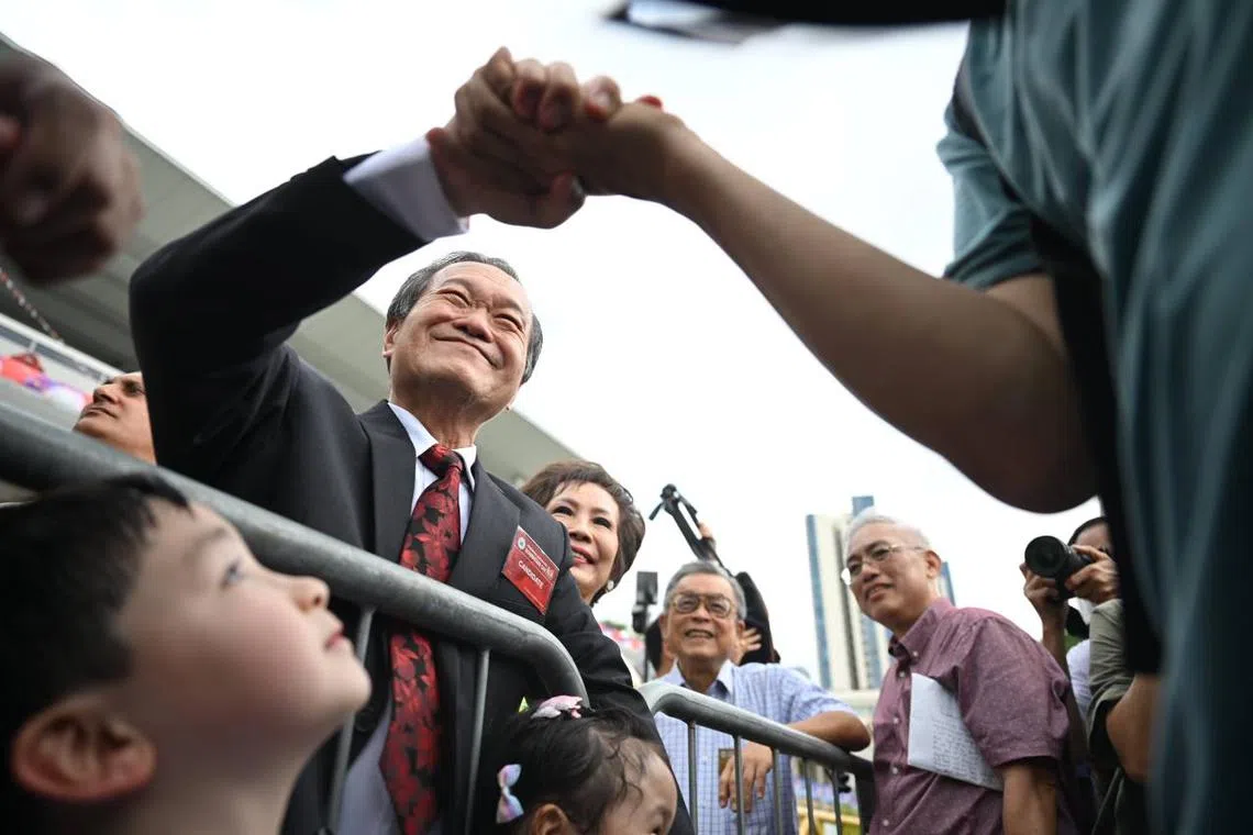 Tan Kin Lian greeting supporters at the nomination centre.