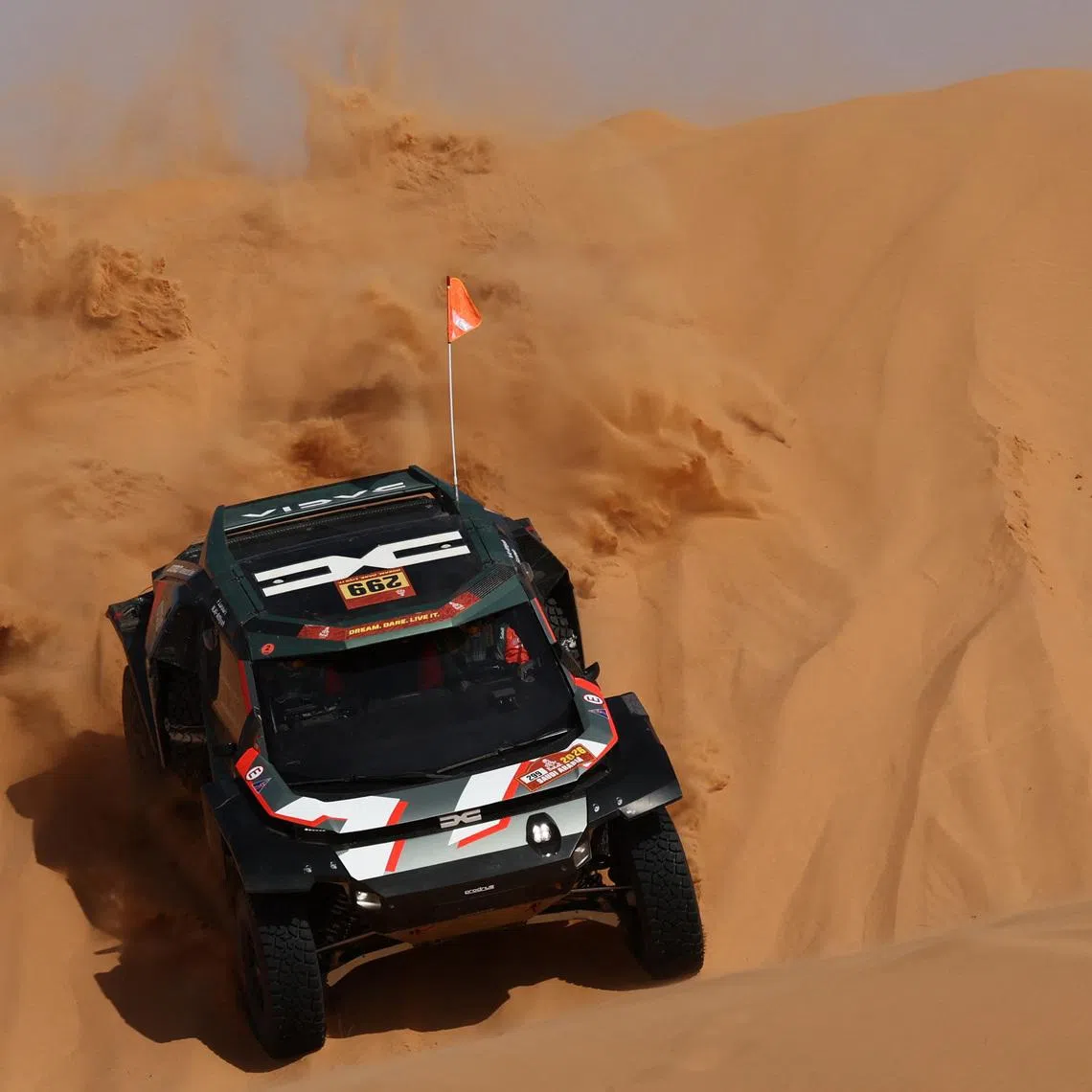Rallying - Dakar Rally - Stage 6 - Hail to Riyadh - Hail, Saudi Arabia - January 9, 2026 Dacia's Nasser Al-Attiyah and Fabian Lurquin in action during stage 6. REUTERS/Stephane Mahe
