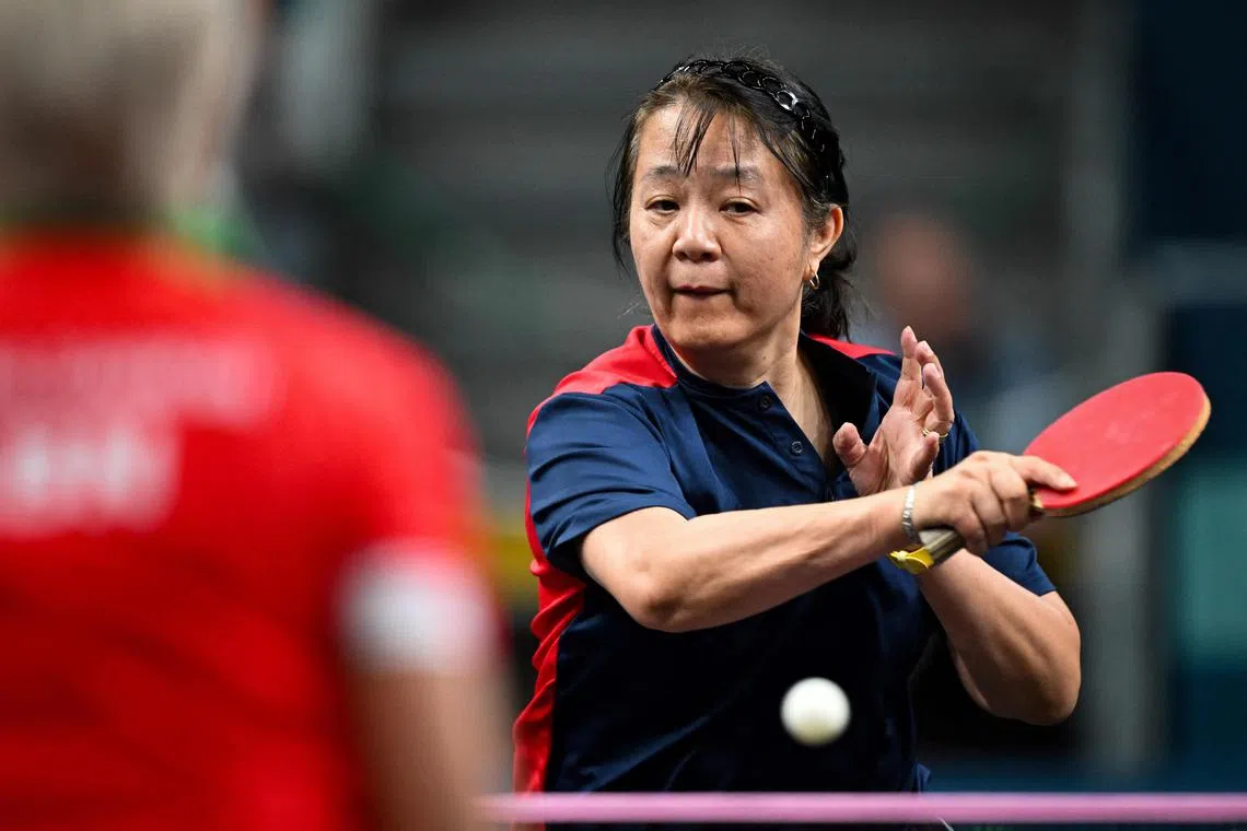 Chile's Zhiying Zeng plays a return to Lebanon's Mariana Sahakian during their women's table tennis singles preliminary round at the Paris 2024 Olympic Games at the South Paris Arena in Paris on July 27, 2024. (Photo by JUNG Yeon-je / AFP)