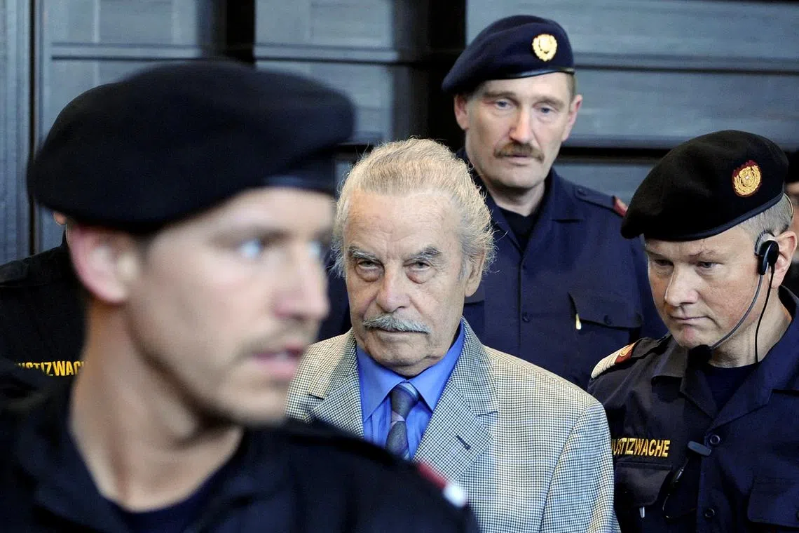 Josef Fritzl (centre) held his daughter captive for 24 years and raped her countless times, fathering seven children over the period. 