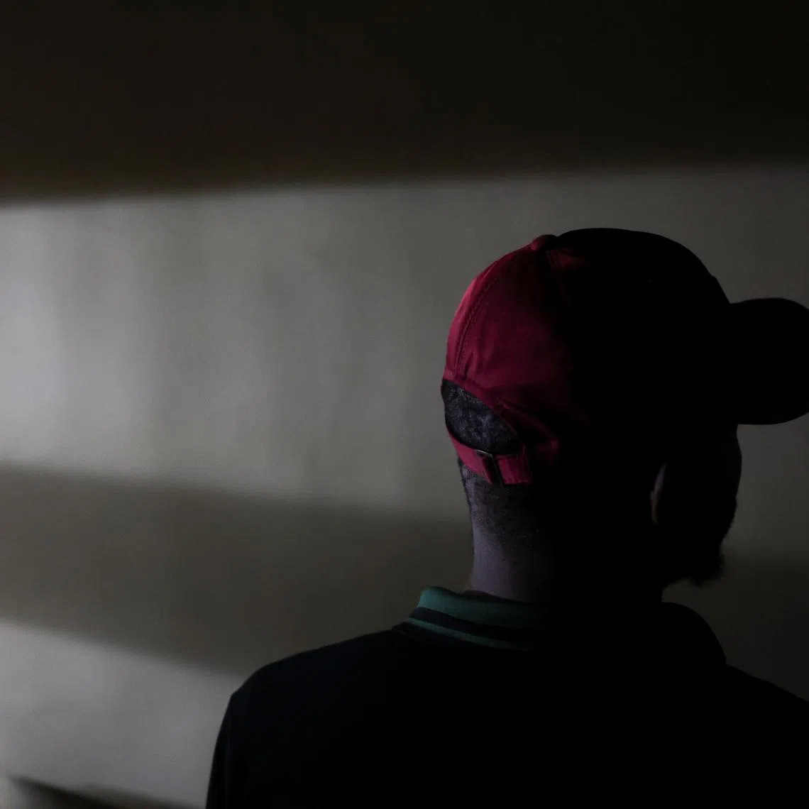 A person who contracted Human Immunodeficiency Virus (HIV) after losing access to Pre-exposure Prophylaxis (PrEP), poses for a photo in Asaba, Delta State, Nigeria, May 31, 2025. REUTERS/Sodiq Adelakun