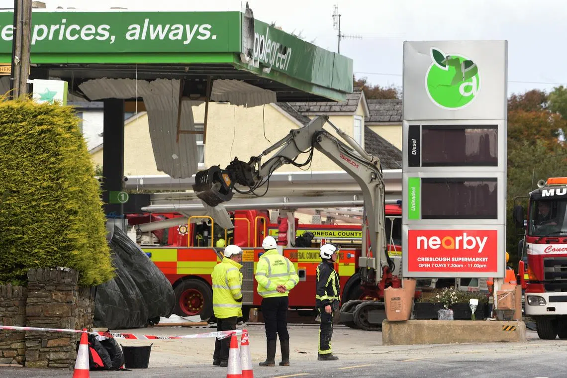 FILE PHOTO: Emergency services attend the scene of a explosion, resulting in multiple deaths, at a service station in the village of Creeslough, in County Donegal, Ireland, October 8, 2022. REUTERS/Trevor McBride/File Photo