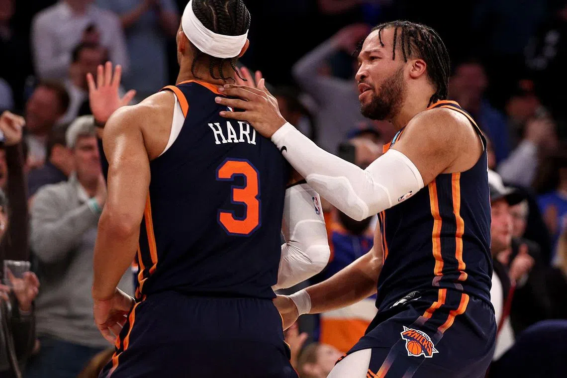 Josh Hart and Jalen Brunson of the New York Knicks celebrate the game-winning basket in the final minutes of the game against the Detroit Pistons at Madison Square Garden.