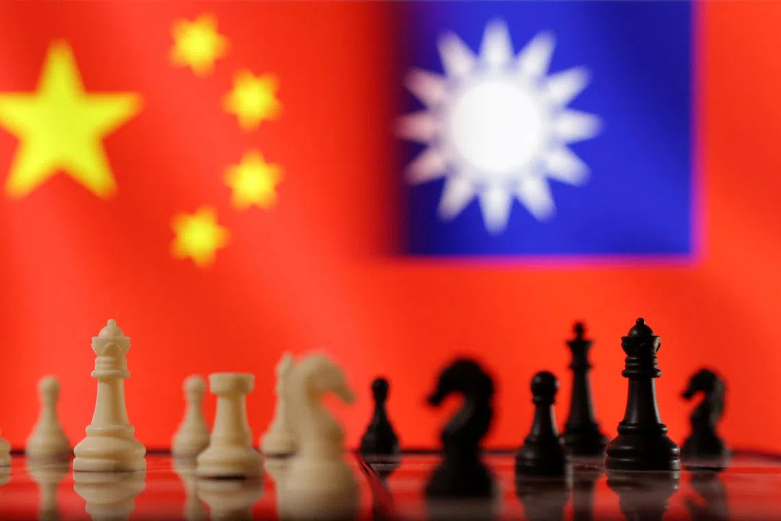 FILE PHOTO: Chess pieces are seen in front of displayed Chinese and Taiwanese flags in this illustration taken, April 11, 2023. REUTERS/Dado Ruvic/Illustration/File Photo