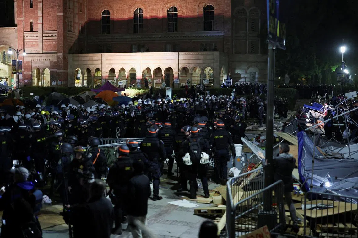 FILE PHOTO: Law enforcement officers stand guard at the University of California Los Angeles (UCLA), during a pro-Palestinian protest, as the conflict between Israel and the Palestinian Islamist group Hamas continues, in Los Angeles, California, U.S., May 2, 2024. REUTERS/Mike Blake/File Photo
