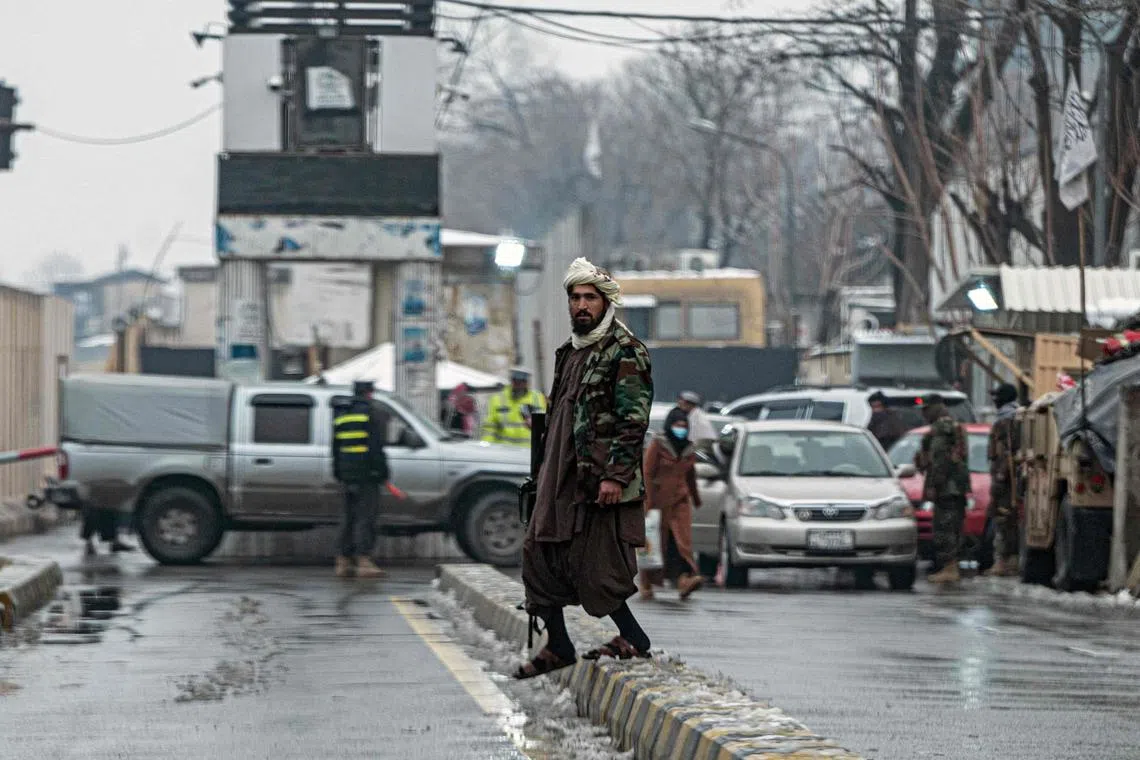 A member of the Taliban security force stands guard on a blocked road, after a suicide blast near Afghanistan's foreign ministry in Kabul on Jan 11, 2023.