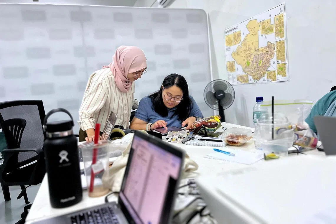 MUDA’s Puteri Wangsa candidate, Rashifa Aljunied, 26 (pink headscarf) preparing for her nomination in June 27.