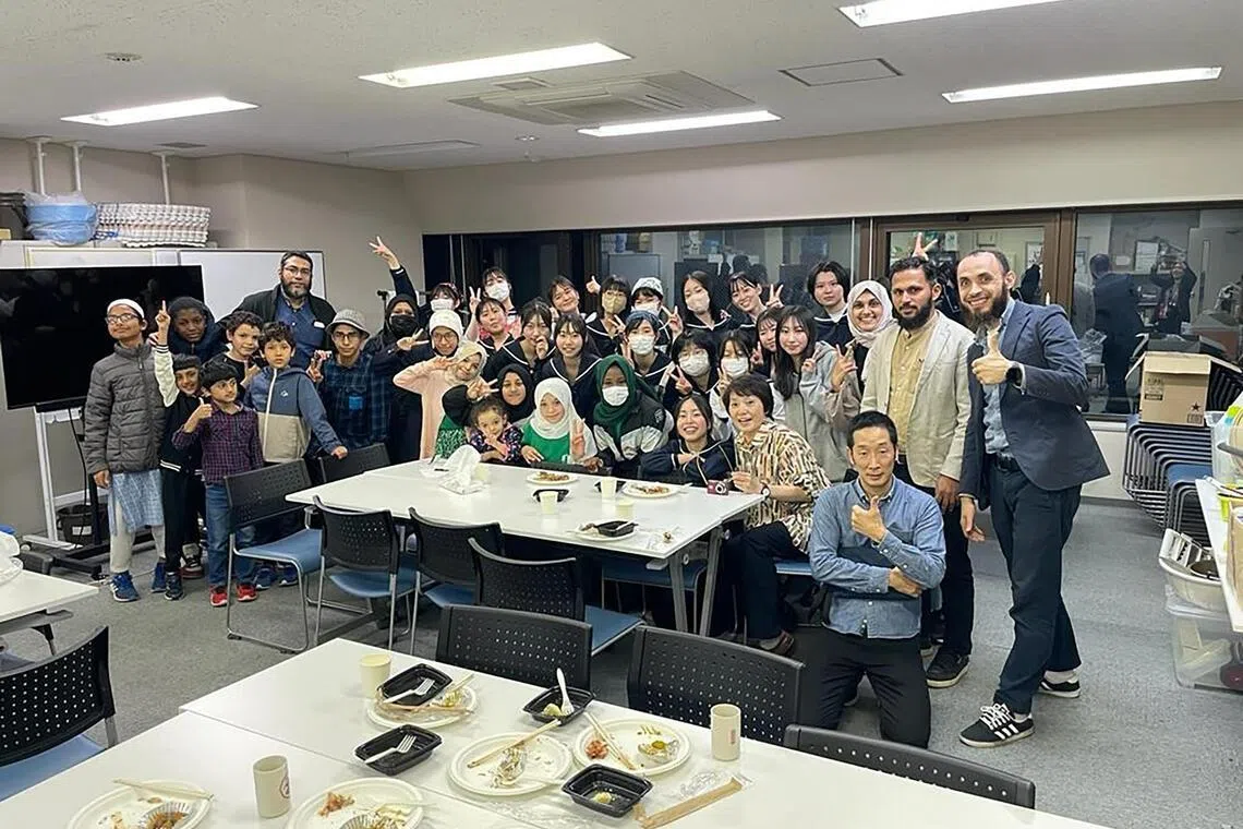Students and staff of Sapporo International School, including principal Mohamed Shehata (right), pose with students from the nearby Hokusei Gakuen Girls’ Junior High School after a cooking class where they learnt to cook halal food together and shared it.