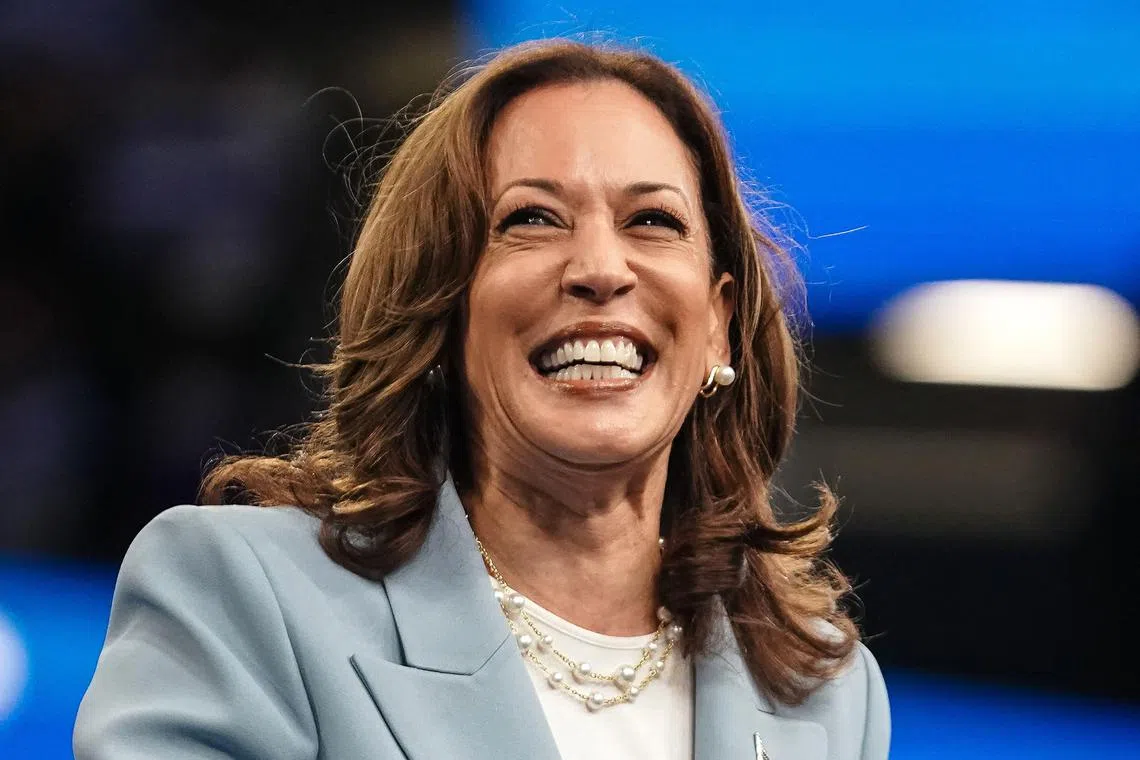 US Vice President and 2024 Democratic presidential candidate Kamala Harris smiles as she takes the podium to speak at a campaign rally in Atlanta, Georgia, on July 30, 2024. (Photo by Elijah Nouvelage / AFP)