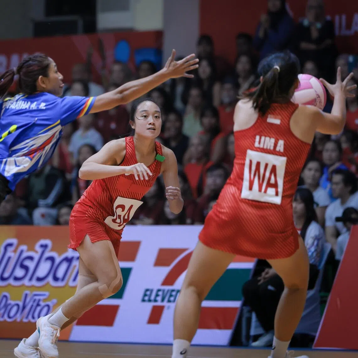 Singapore's Toh Kai Wei (centre) and Angeline Lim in action in the SEA Games final against Malaysia at Chanthanayingyong Gymnasium on Dec 17.