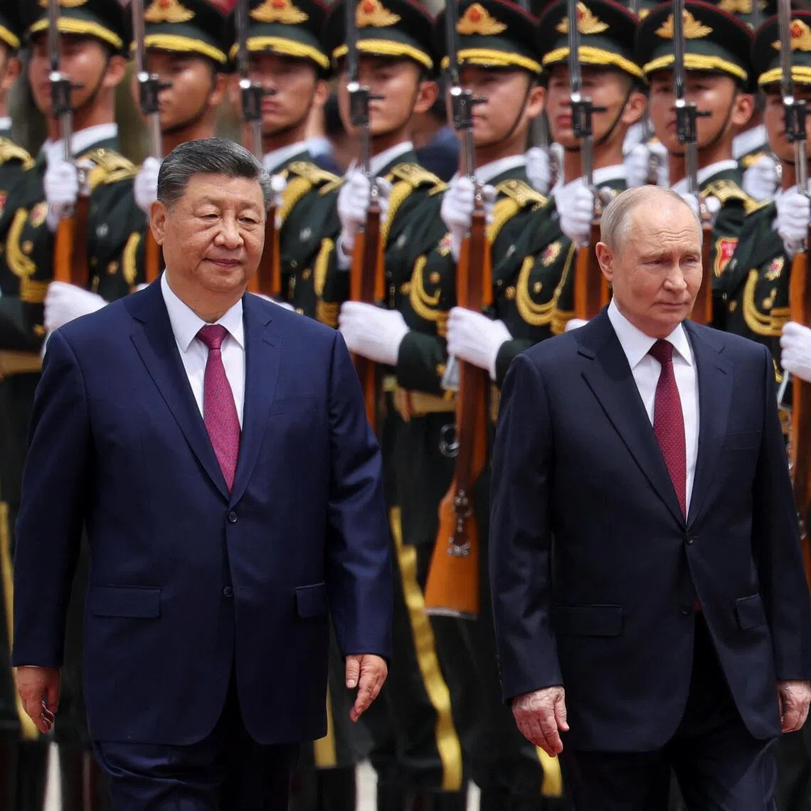 Chinese President Xi Jinping and Russian President Vladimir Putin inspecting an honour guard during a welcome ceremony for Mr Putin in Beijing on May 20.