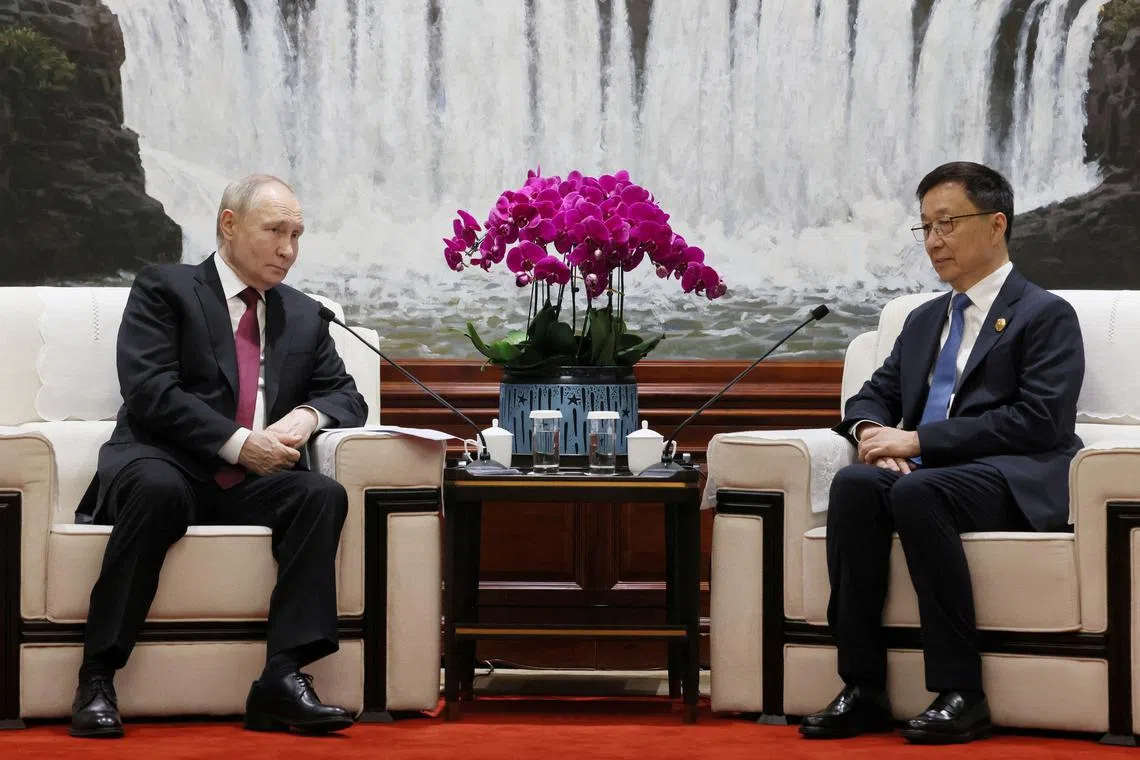FILE PHOTO: Russian President Vladimir Putin and Chinese Vice President Han Zheng attend a meeting in Harbin, China, May 17, 2024. Sputnik/Mikhail Metzel/Pool via REUTERS/File Photo