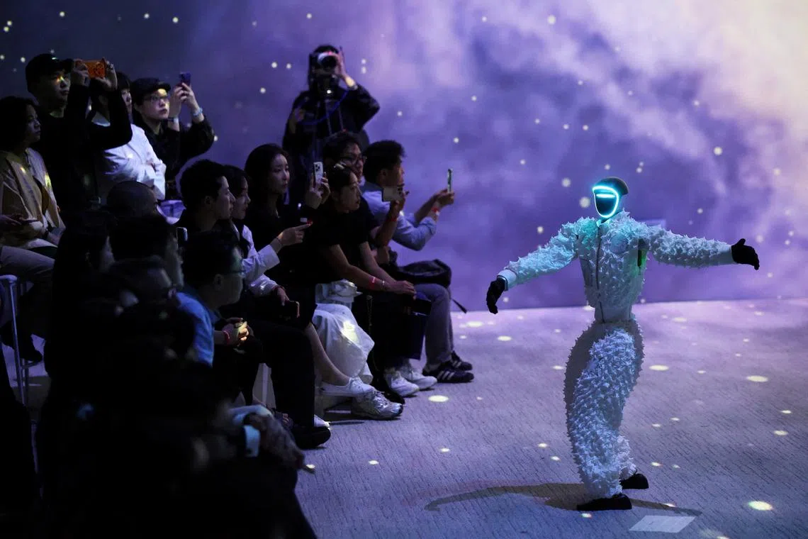 A humanoid robot presenting a creation during Galaxy Corporation's Mach33: Physical AI Fashion Show in Seoul, South Korea, on May 28, 2026.