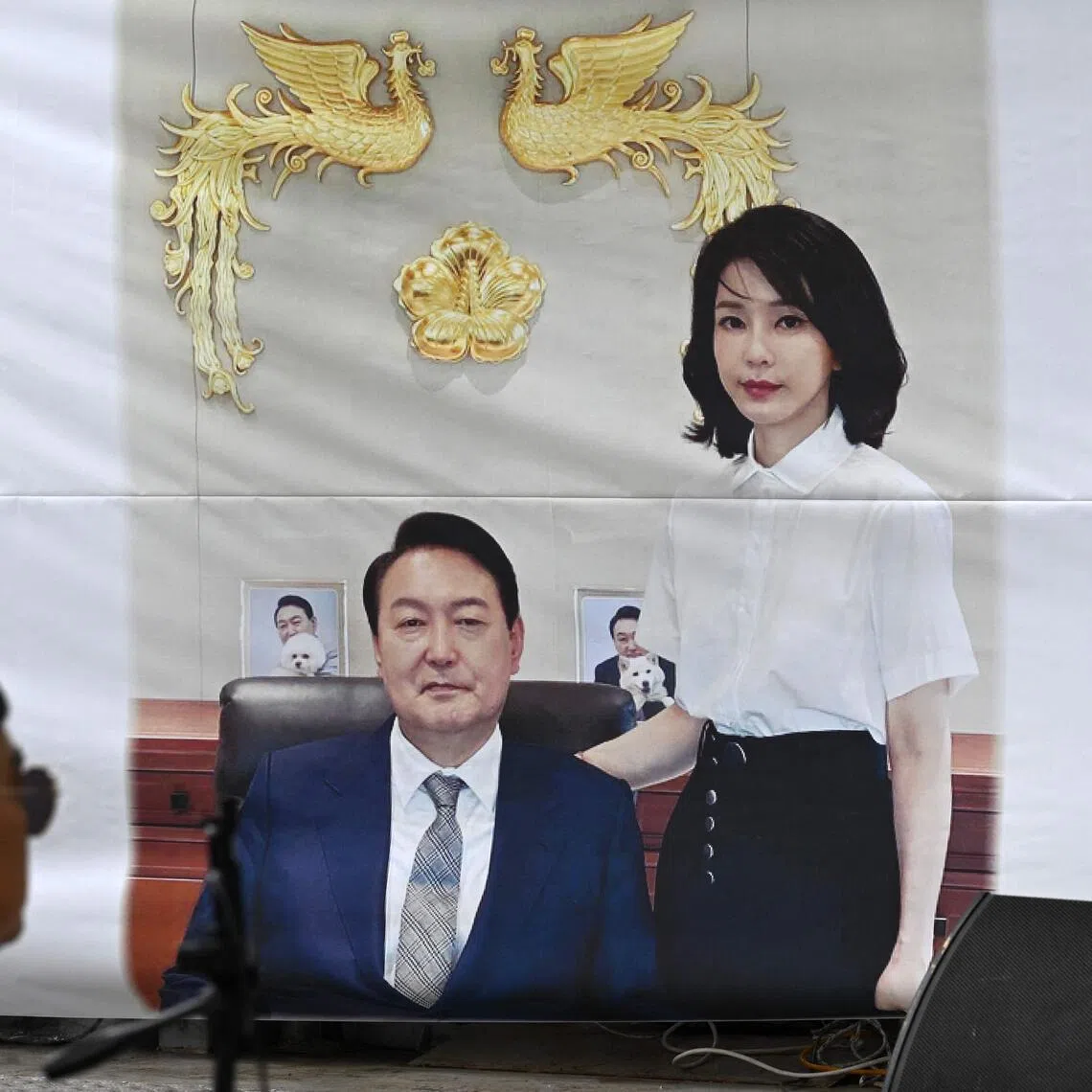 A banner showing a picture of South Korea's former president Yoon Suk Yeol and his wife Kim Keon Hee on a street near the Seoul High Court.