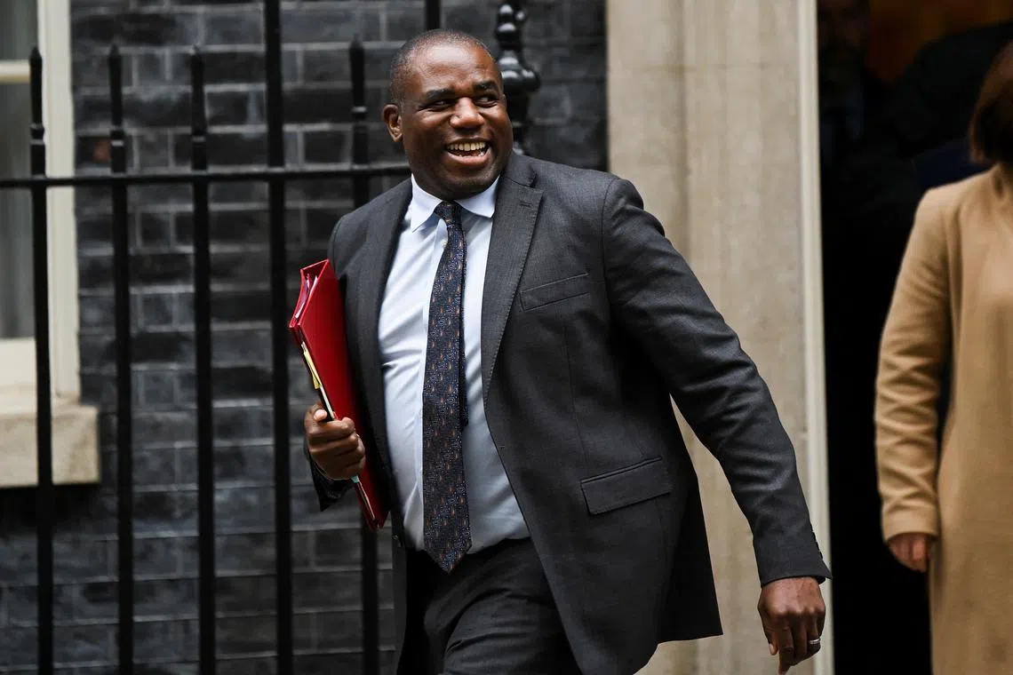 FILE PHOTO: Britain's Foreign Secretary David Lammy walks outside 10 Downing Street, in London, Britain, October 15, 2024. REUTERS/Jaimi Joy/File Photo