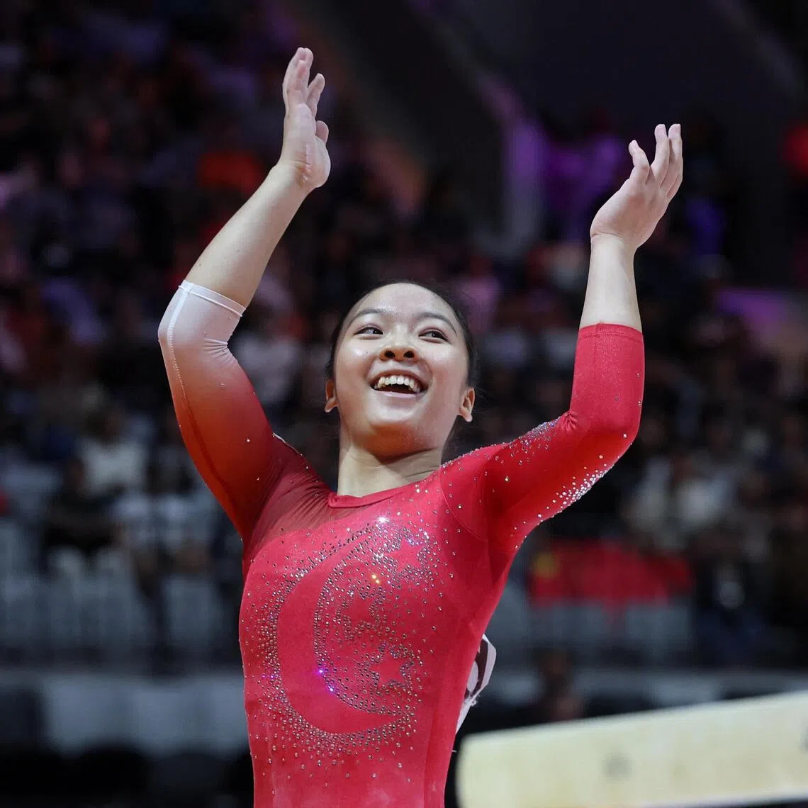 Singapore's Amanda Yap smiling after completing her balance beam routine REUTERS/Ajeng Dinar Ulfiana