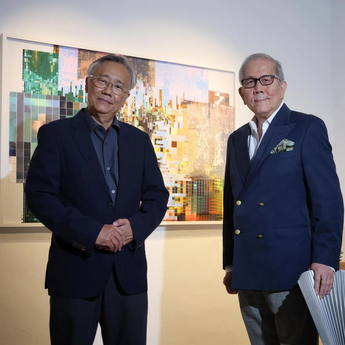Culture Story founder Chong Huai Seng (R) and curator Kwok Kian Chow pictured with the Lee Kuan Yew bust and a work by Ming Wong. 