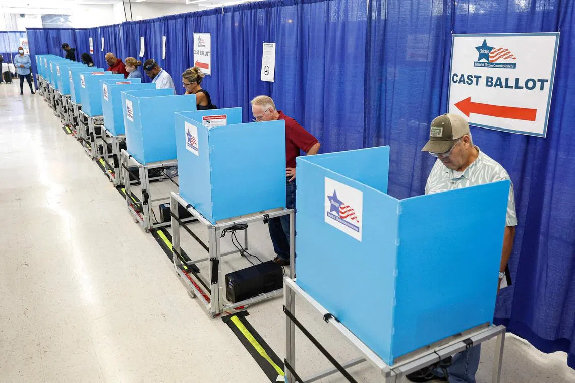 Voters fill out their ballots on the second day of early voting in the 2024 presidential election in Chicago, Illinois, on Oct 4.