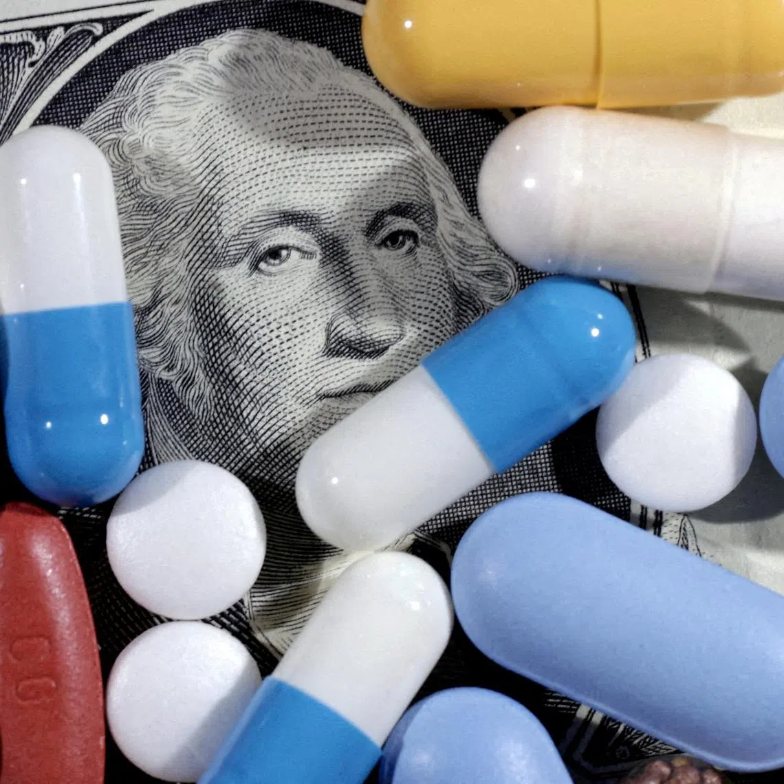 FILE PHOTO: U.S. dollar banknote and medicines are seen in this illustration taken, June 27, 2024. REUTERS/Dado Ruvic/Illustration//File Photo