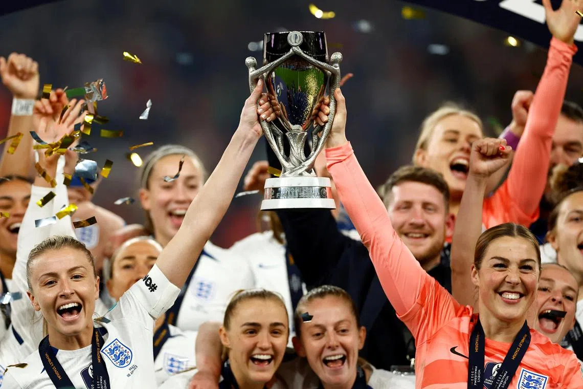 England captain Leah Williamson (left) and Mary Earps celebrating winning the Women's Finalissima with the trophy and their teammates after beating Brazil on penalties at Wembley on Thursday.