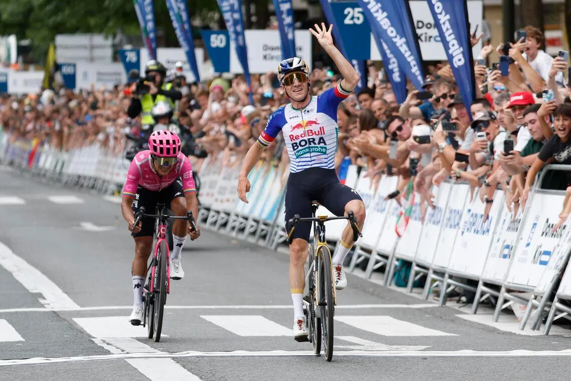 Belgian rider Remco Evenepoel (right) celebrating after out sprinting Ecuadorian Richard Carapaz to win the 45th edition of the San Sebastian Classic 2026 cycling race in San Sebastian, Spain, on Aug 1.