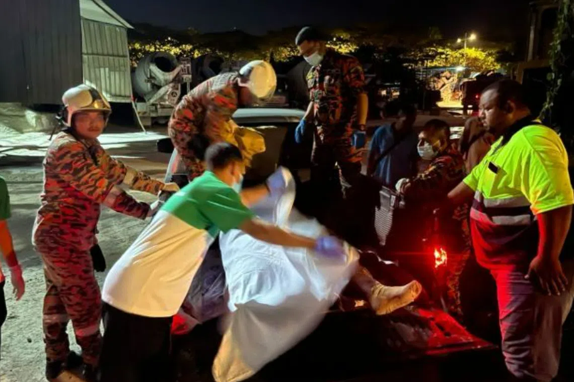 Firemen had to use a special blanket to lift the man onto a 4x4 truck belonging to his employer.