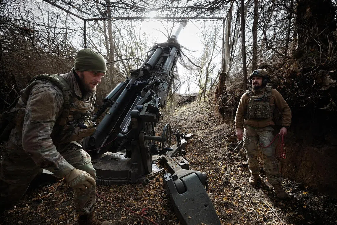 Ukrainian servicemen firing at Russian targets in the Zaporizhzhia region of eastern Ukraine on Oct 14.