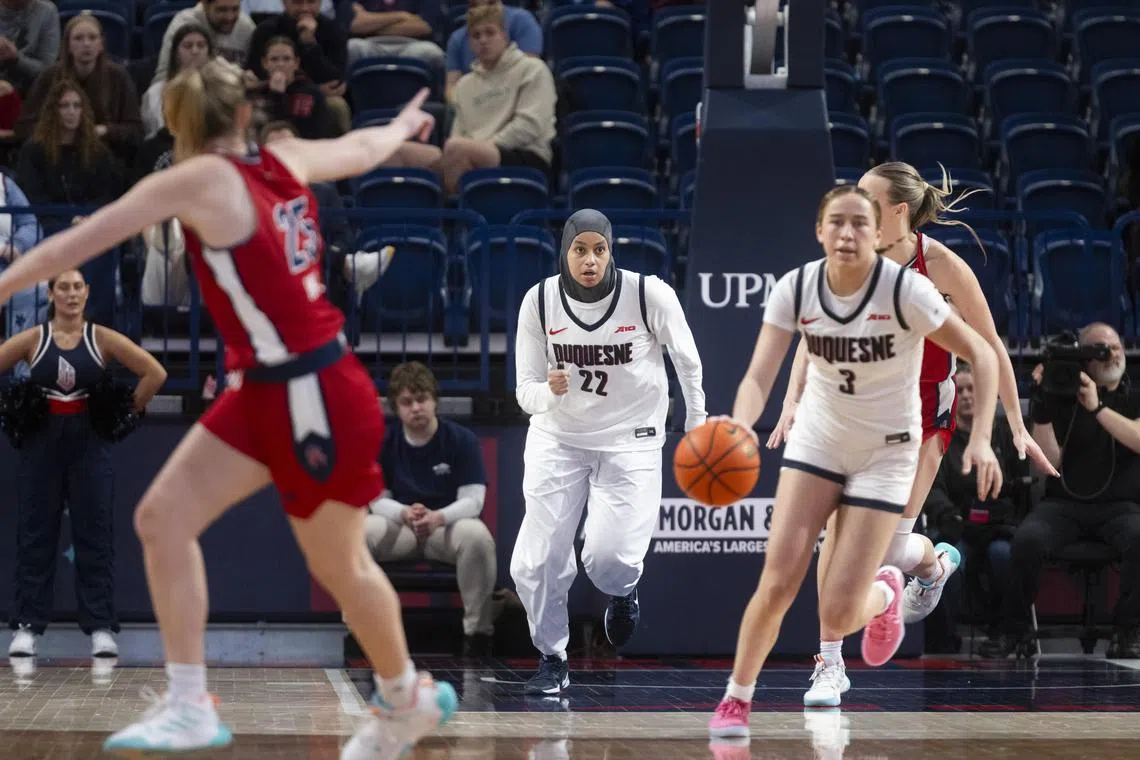 Kiandra Browne, a forward for Duquesne University, wears a hijab along with long sleeves and pants, during a game against Richmond at UPMC Cooper Fieldhouse in Pittsburgh, Feb 9, 2025. 