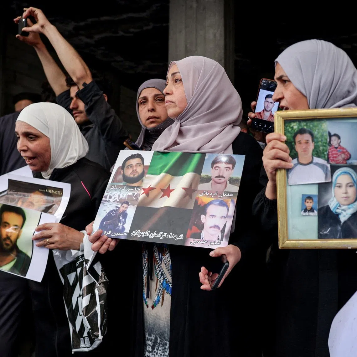 Residents gather in a street after Friday prayers to celebrate the arrest of Amjad Yousef, a key suspect in the 2013 Tadamon massacre, in Tadamon, Syria, April 24, 2026. REUTERS/Khalil Ashawi