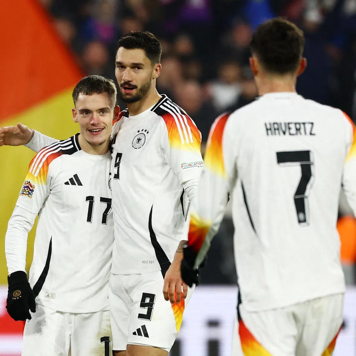 Germany's Florian Wirtz celebrates scoring their fifth goal with Tim Kleindienst.
