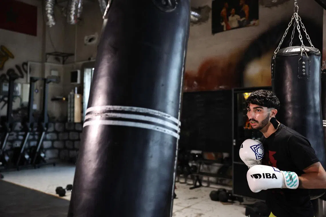 Palestinian lightweight boxer Waseem Abu Sal training at a gym in Ramallah city in the occupied West Bank on June 22, as part of his preparations after qualifying for the upcoming 2024 Paris Olympic Games.