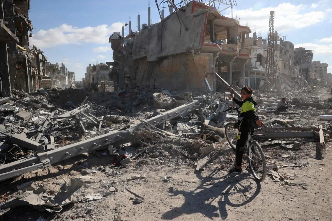 A Palestinian youth in a ruined neighbourhood of Gaza's southern city of Rafah on Jan 20, amid a ceasefire in Israel's war on Hamas militants.