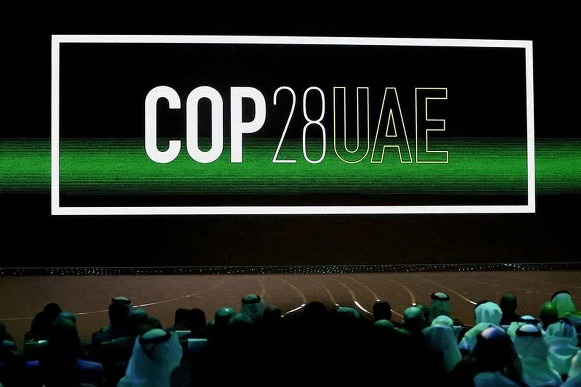 FILE PHOTO: 'Cop28 UAE' logo is displayed on the screen during the opening ceremony of Abu Dhabi Sustainability Week (ADSW) under the theme of 'United on Climate Action Toward COP28', in Abu Dhabi, UAE, January 16, 2023. REUTERS/Rula Rouhana/File Photo