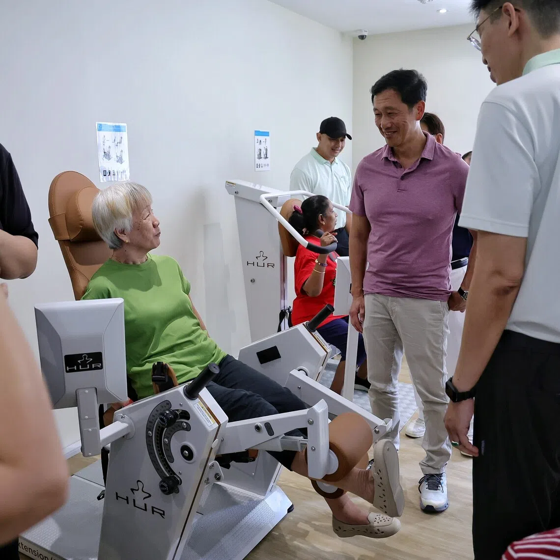 Health Minister Ong Ye Kung (in purple) interacting with seniors working out at the Longevity Courtyard in GLOW (Nanyang) during its opening at 706 Jurong West Street 71 on Nov 15.